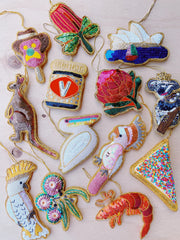 Collection of colorful embroidered patches on a beige background